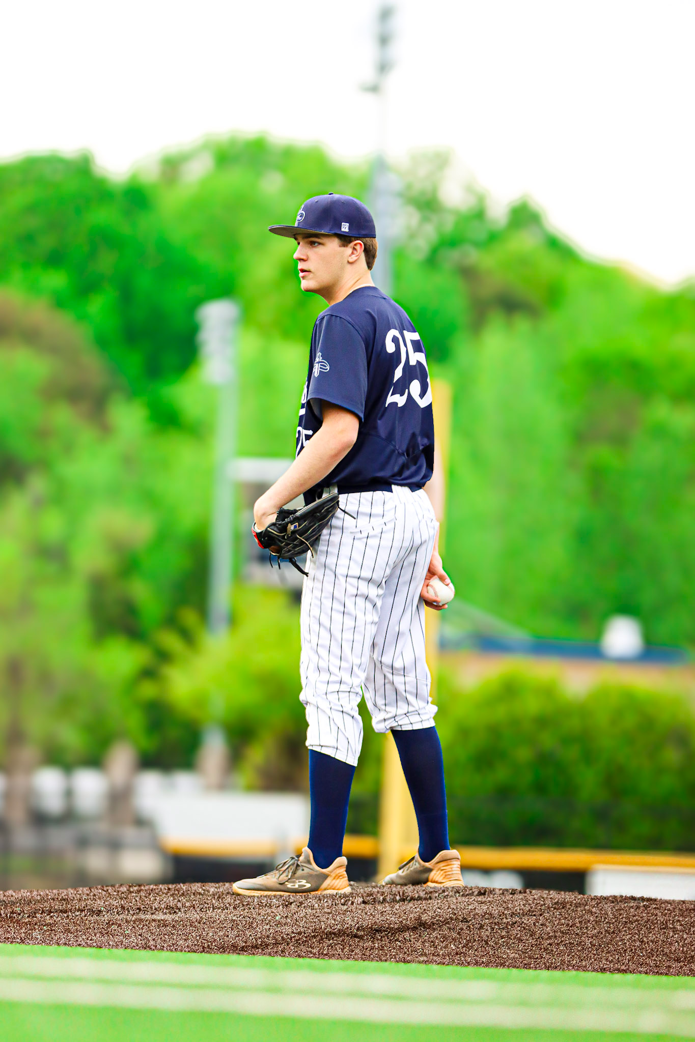 Carter Smith pitching for Pace Academy varsity baseball, number 25
